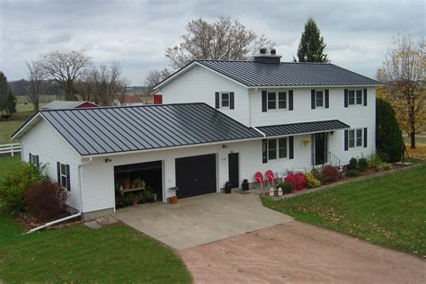 charcoal gray metal roof on white house|dark grey metal roof.